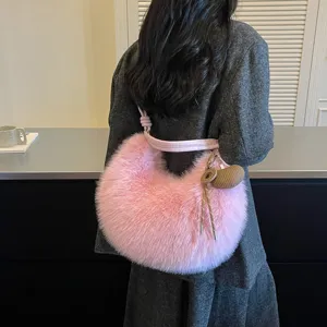 Pink plush hobo shoulder bag detail showing soft faux fur texture and cute charm pendant.