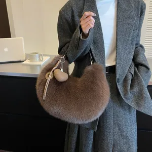 Brown faux fur hobo shoulder bag detailed view, trendy autumn fashion commute crossbody handbag.