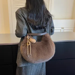 Brown faux fur hobo shoulder bag for women, plush crescent crossbody purse for autumn winter.