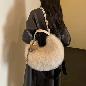 Stylish women's plush crescent shoulder bag, soft furry faux fur hobo handbag for autumn and winter.
