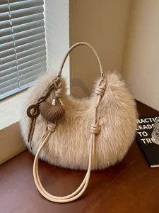 Chic plush shoulder bag for women, trendy fluffy hobo handbag with cute heart pendant.