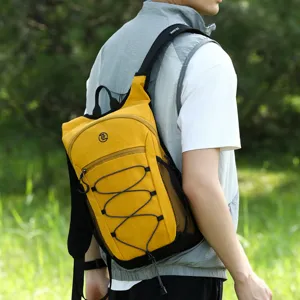 Outdoor lightweight hiking backpack detail shot, yellow wear with black mesh and bungee cords.