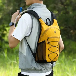 Outdoor lightweight hydration backpack detail view with water tube and mesh pocket.