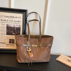 Large capacity casual tote shoulder bag for women, retro brown design with decorative charms.