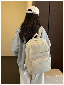 Casual canvas backpack for women, multi-pocket school bag for travel and daily commute.