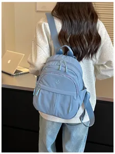 Detail view of Korean style blue casual backpack, large capacity travel school bag for women.