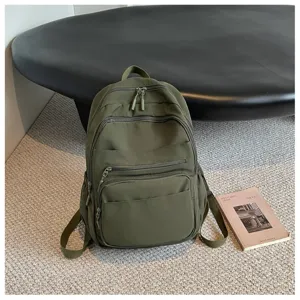 Casual dark green backpack with multiple zipper pockets for women, outdoor travel and daily school use.