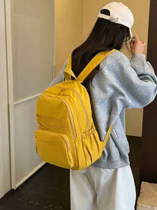 Casual yellow backpack for women, outdoor travel school bag shown from back view main image.
