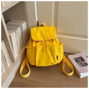Sac à dos femme en tissu jaune décontracté pour voyage quotidien, grand format léger.