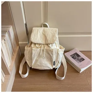 Sac à dos femme en toile détail, tissu léger de grande capacité pour le voyage.