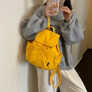 Sac à dos décontracté en toile jaune pour femme, sac de voyage léger avec cordon de serrage.