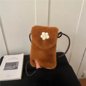 Detailed view of the brown plush mini crossbody phone bag featuring a cute crochet daisy flower.