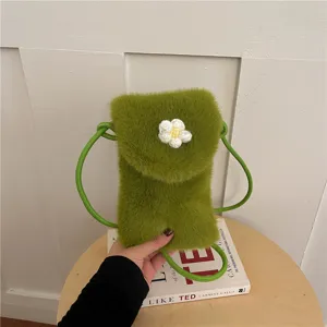 Green plush phone bag with cute white flower detail, soft crossbody shoulder handbag.