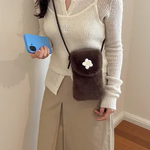 Chic brown plush crossbody phone bag for women, cute floral accent and slim strap.