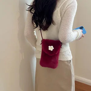 Stylish fuzzy cross-body phone bag for women, cute plush mini shoulder bag with white flower.