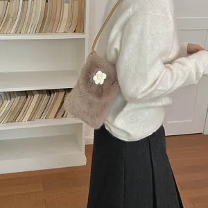 Chic brown plush crossbody phone bag with cute daisy flower detail, soft winter accessory.