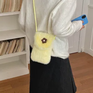 Detailed view of the yellow plush phone bag with a cute brown flower, perfect for casual daily.
