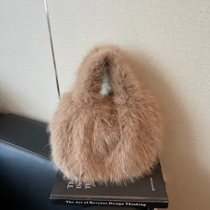Detail shot of trendy brown faux fur handbag, plush texture and soft material for daily wear.
