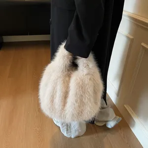 Detailed view of women fluffy plush handbag, soft faux fur tote bag for autumn winter fashion.