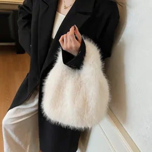 Stylish women's fluffy faux fur handbag, soft plush tote bag for autumn fashion and daily wear.