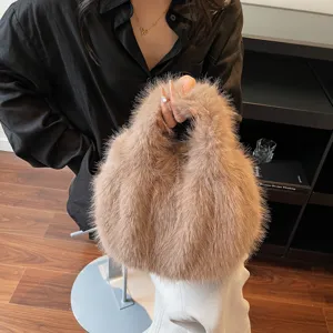 Fluffy faux fur handbag detail, soft khaki plush material texture, cozy autumn fashion style.