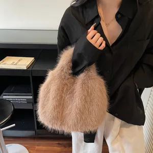 Brown plush handbag detail shot, showing soft faux fur texture and elegant autumn style.