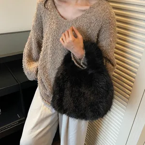 Stylish black faux fur handbag for women, fluffy texture, ideal for autumn fashion daily wear.