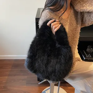 Detail shot of the stylish black fluffy plush handbag showcasing soft texture and trendy design.
