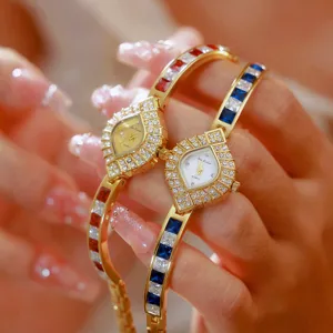 Luxury women quartz bracelet watch with sparkling crystal stones and elegant gold-plated band.
