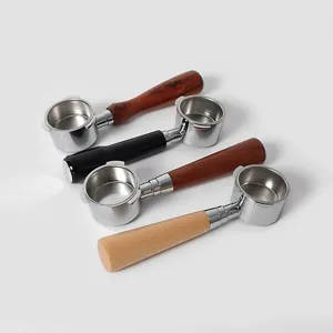 Universal espresso machine bottomless portafilter with multi-material handles and filter basket.