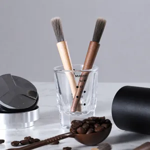 Coffee grinder cleaning brush set with soft PBT bristles and wooden handle for baristas.