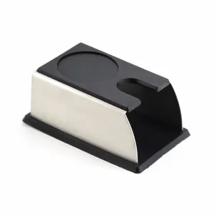 Stainless steel and silicone coffee tamper holder mat, durable espresso accessory for baristas.