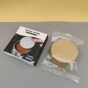 Round unbleached paper coffee filters 58mm, 100 pieces per pack for espresso and drip pots.