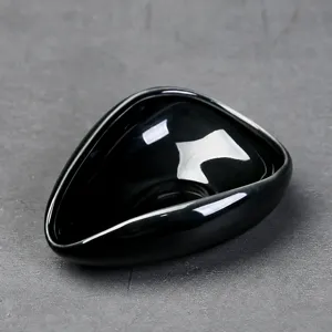 Black ceramic coffee bean dish teardrop shape dosing tray for hand drip coffee grinder tools.