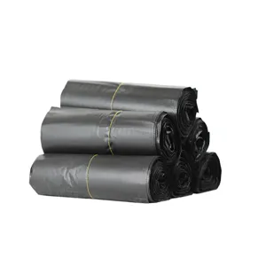 Close-up detail of rolled black garbage bags, durable plastic waste bags for daily cleaning.