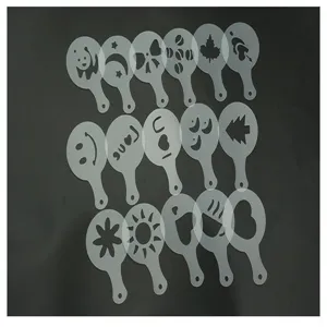 Plastic coffee art stencils detail view, showing hollow pattern designs for milk foam printing.