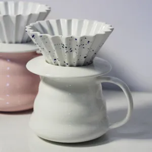 Ceramic pour over coffee dripper, origami fluted cone filter cup with blue splatter design.