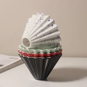 Ceramic origami coffee dripper, V60 conical pour over filter cup for hand brewed coffee.