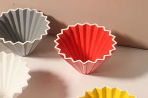 Ceramic origami coffee dripper cone v60 pour over filter cup for barista brewing tool detail.