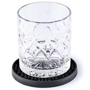 Clear embossed crystal glass tumbler with black anti-slip silicone coaster for bar and home use.