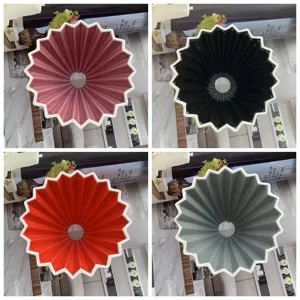 Ceramic origami coffee dripper conical V60 pour over filter cup in multiple colors.