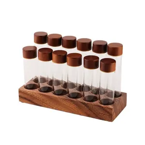 Support en bois de noyer avec tubes en verre pour presenter les grains de cafe et epices.