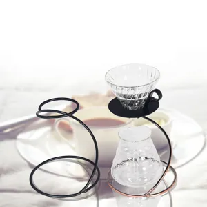 Coffee pour-over stand set with glass dripper server and modern metal serpentine holder.