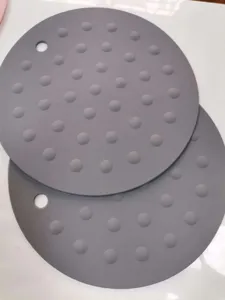 Ronde siliconen hittebestendige mat detail, antislip pannenlap met ophanggat in het grijs.