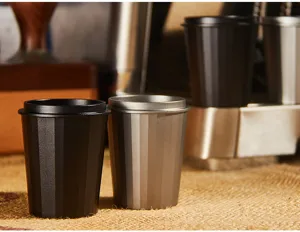 Detailed view of metal coffee dosing cup and powder ring for espresso machine handle.