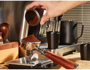 Espresso coffee dosing cup and portafilter funnel set for precise coffee grounds transfer and brewing.