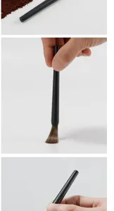 Brosse de nettoyage pour moulin à café avec poils souples et manche noir pour machine.