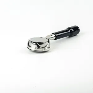Stainless steel bottomless portafilter detail shot, featuring 58mm coffee machine accessory design.