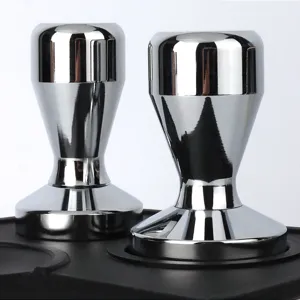 Stainless steel coffee tamper detail view, polished metal espresso distributor for barista.