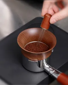 Walnut wood magnetic espresso dosing funnel with WDT needle coffee powder distributor tool.